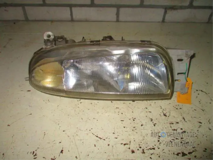 Headlight, left Mazda 121